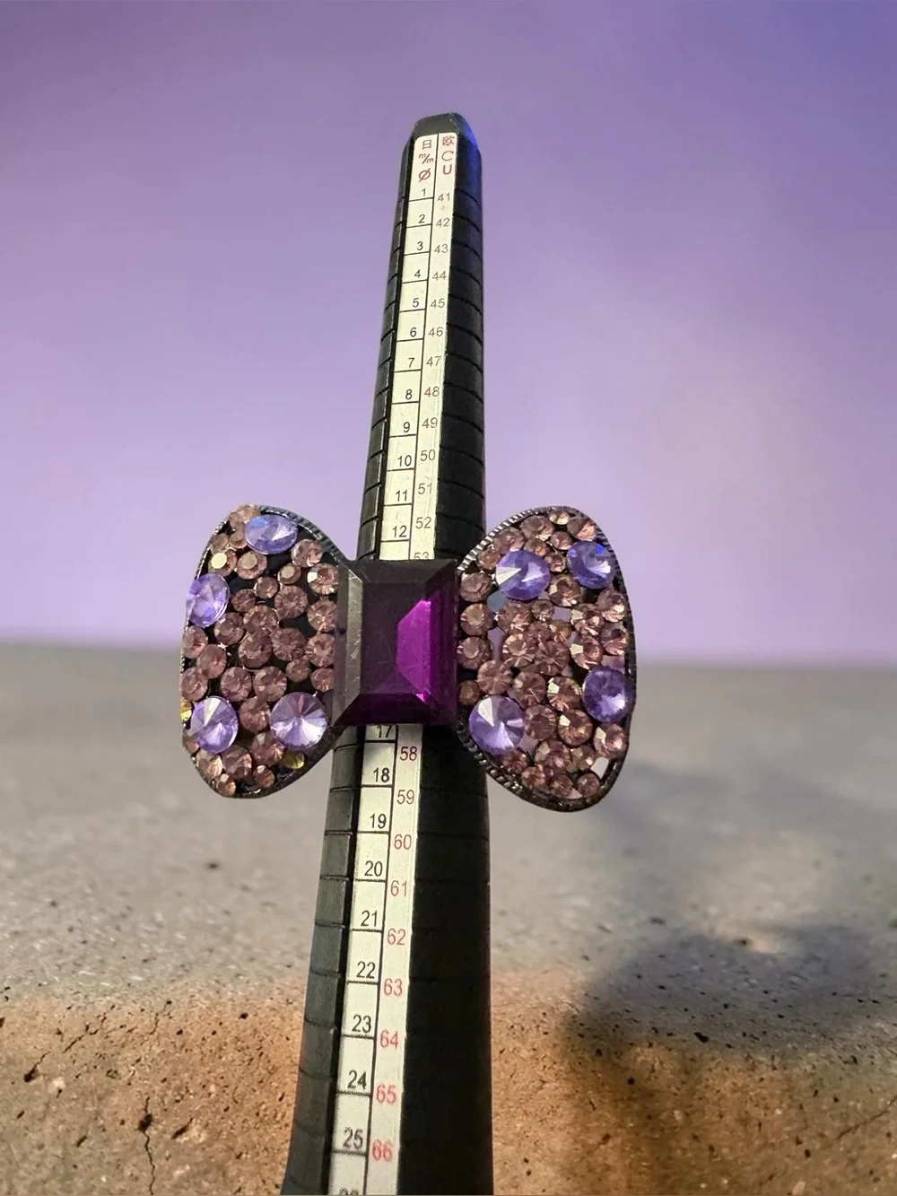 Y2K Purple Rhinestone Bow Statement Ring Adjustable sitting at size 7 1/2